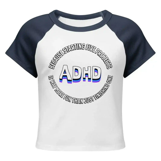 Cady Creations women's white and navy baby tee with ADHD graphic text design on front.