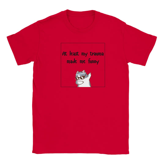 Red graphic tee with the slogan "At least my trauma made me funny" and a cartoon figure wearing sunglasses.