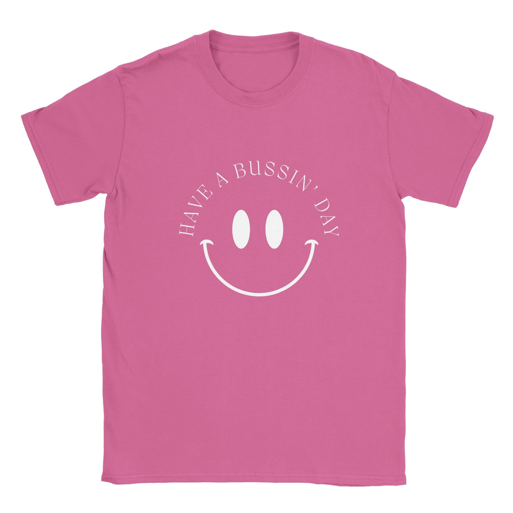 Pink graphic tee with "Have a Bussin' Day" slogan and smiley face design.