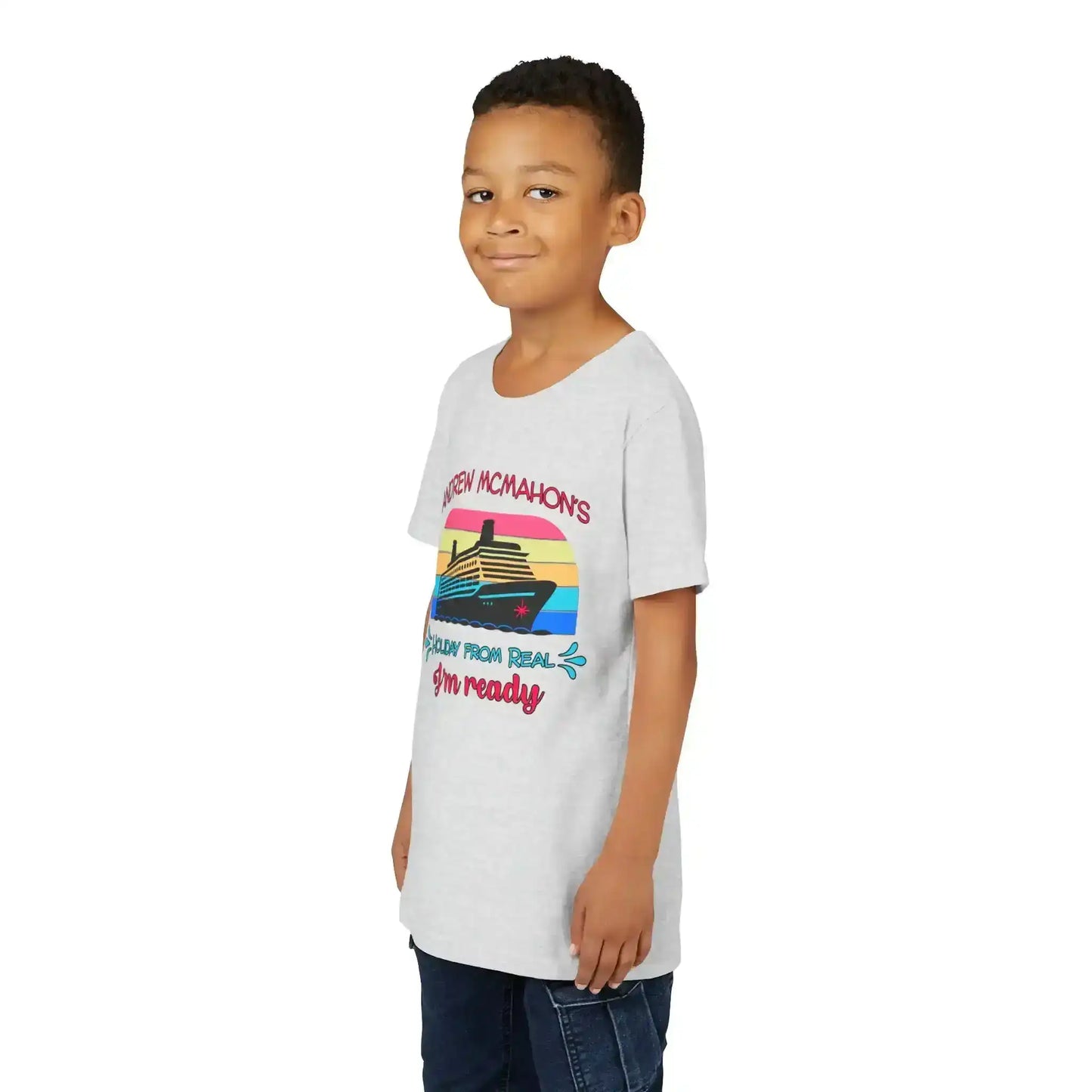 Smiling boy in gray graphic tee with cruise ship design, Cady Creations pop culture shirt