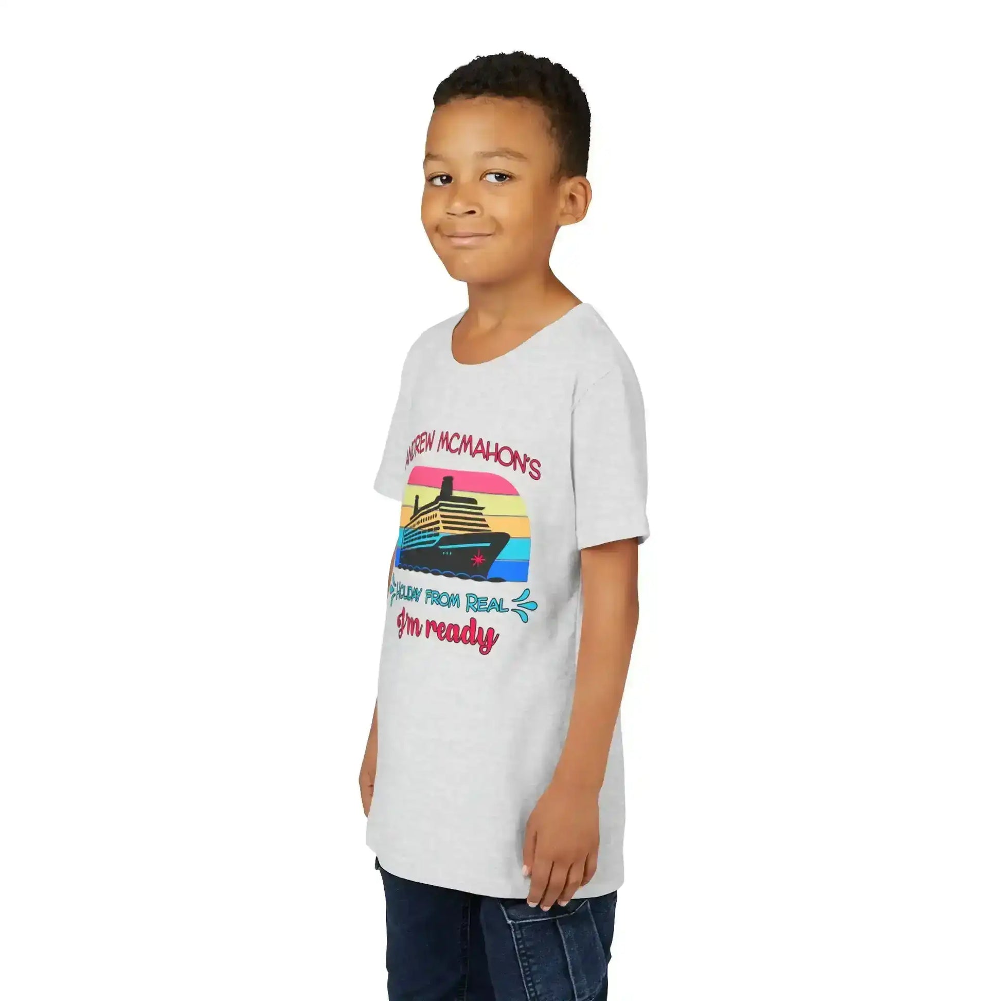Smiling boy in gray graphic tee with cruise ship design, Cady Creations pop culture shirt