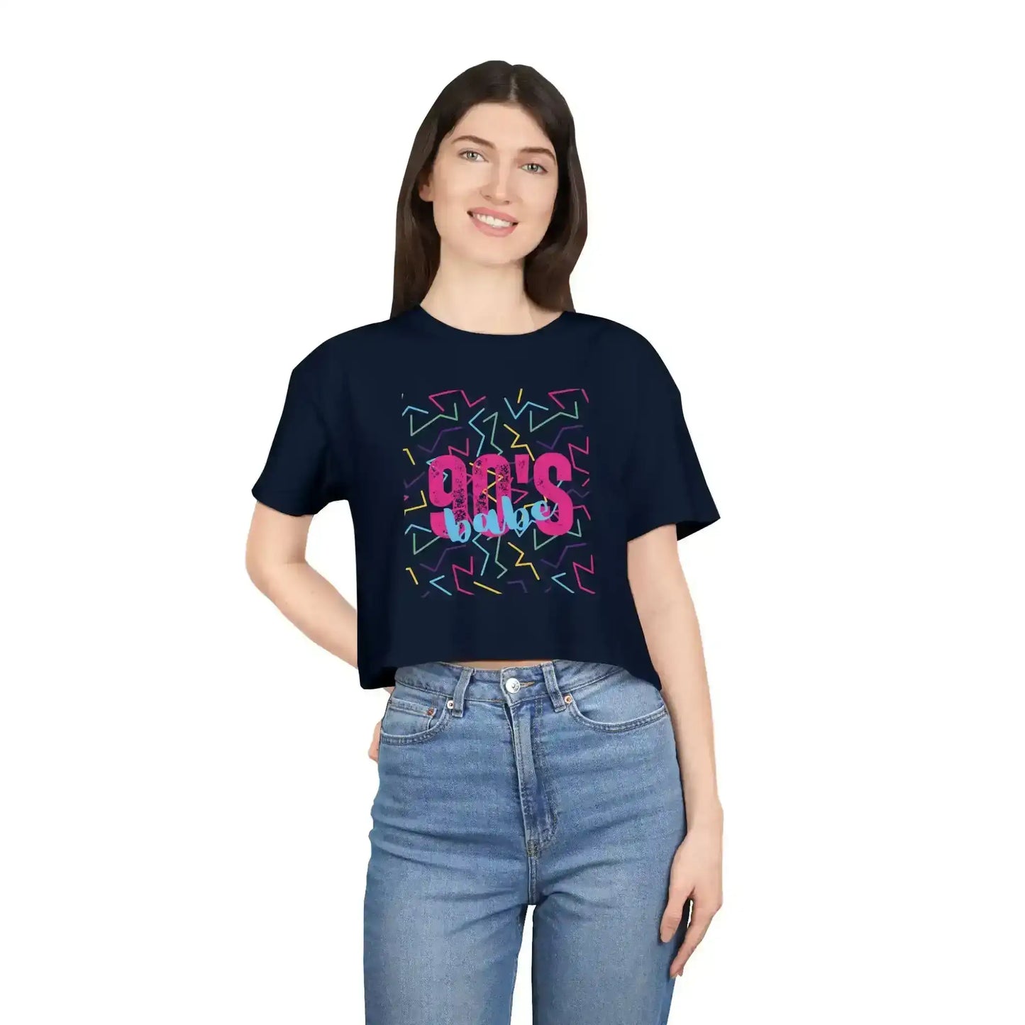 Woman wearing navy graphic tee with '90's babe' text and colorful retro pattern, Cady Creations