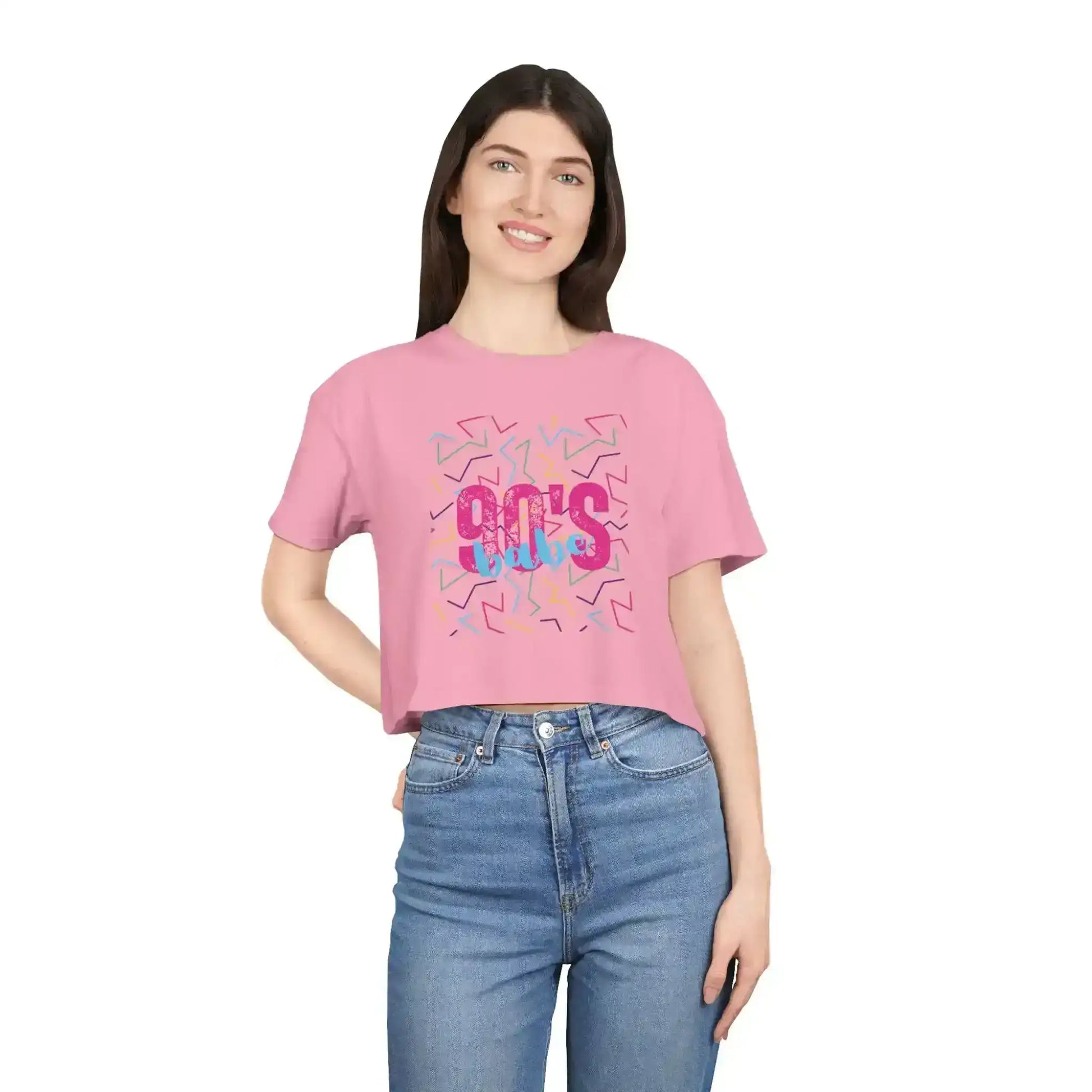 Woman in pink 90s vibes graphic crop top and jeans, Cady Creations pop culture apparel