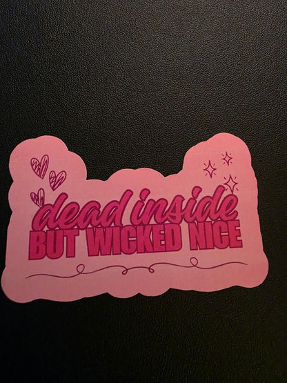 Pink decorative item with text on a black background