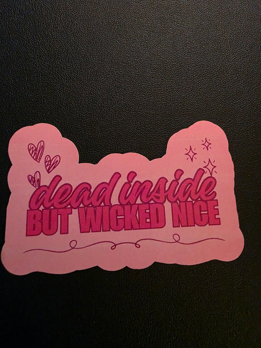 Pink decorative item with text on a black background