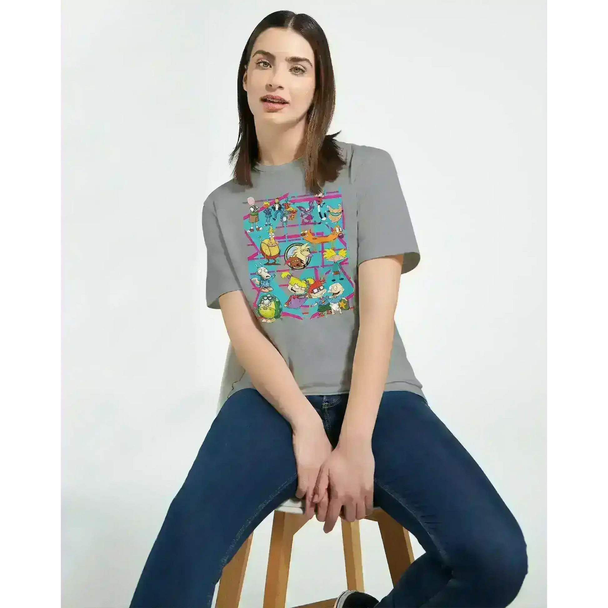 Woman wearing grey retro 90s cartoon squad graphic t-shirt from Cady Creations
