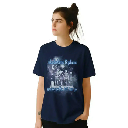 Woman wearing Cady Creations navy tee with skeletons and celestial graphic, 'skeletons & plans' text