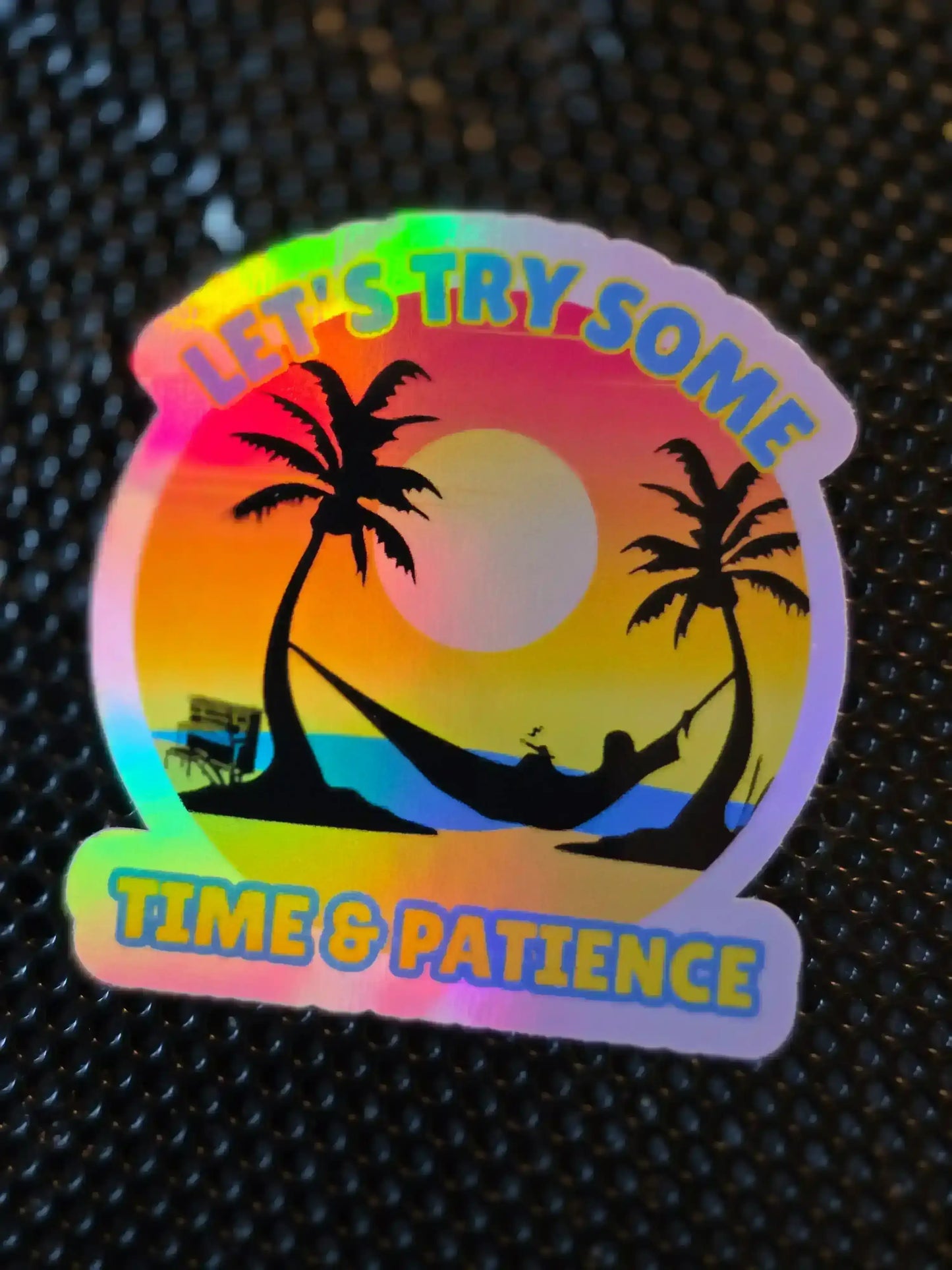 Holographic sticker with palm trees, hammock, sunset, and 'LET'S TRY SOME TIME & PATIENCE' text
