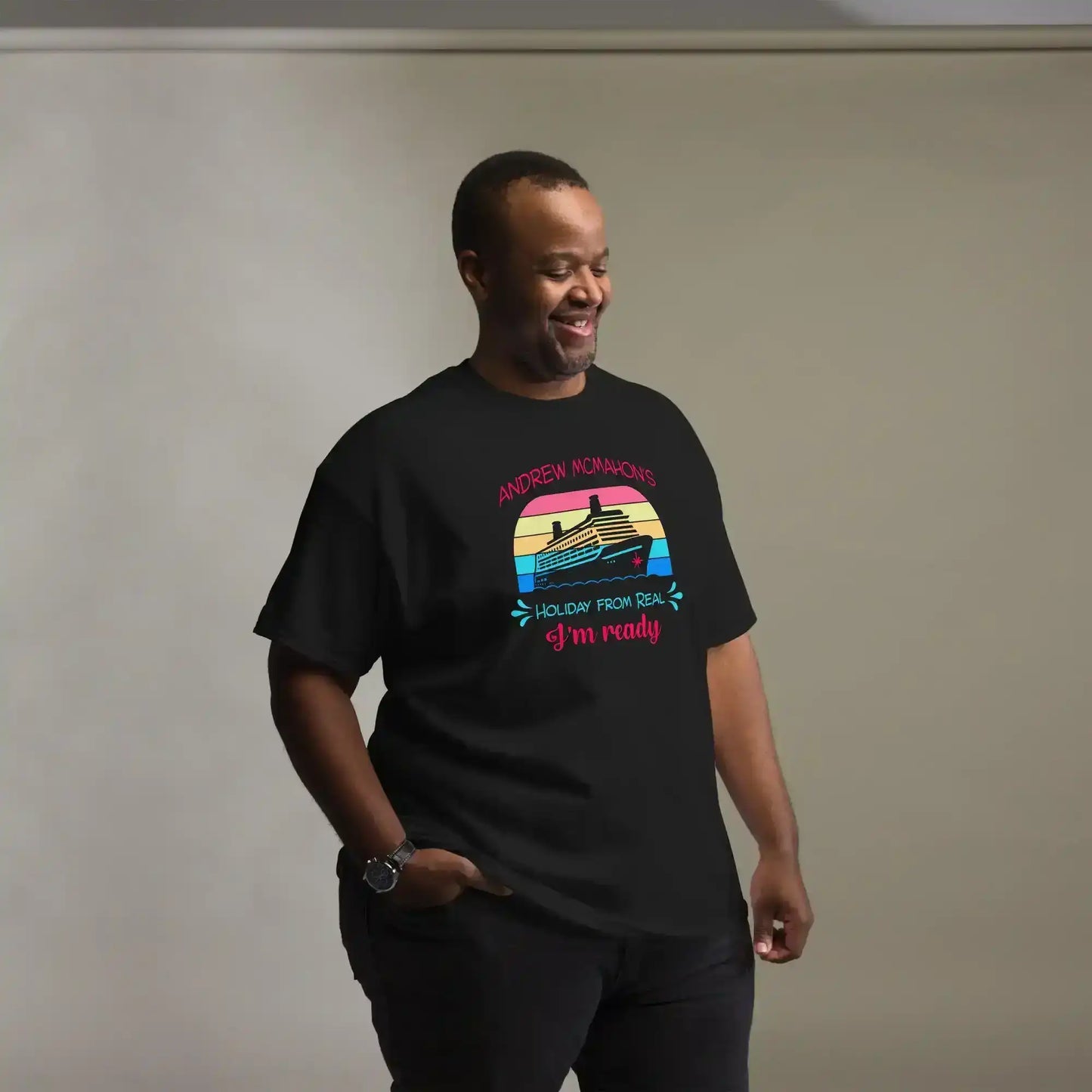 Man wearing black graphic tee with cruise ship and retro sunset design from Cady Creations