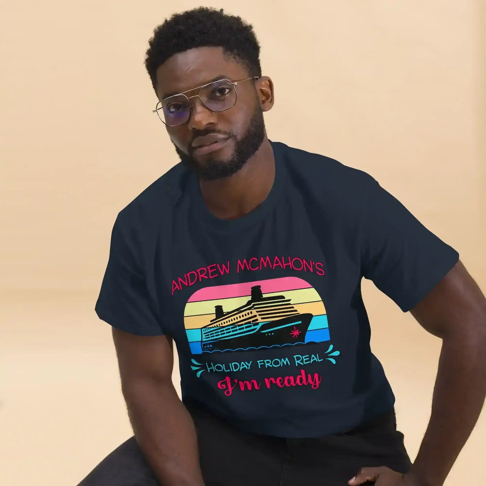 Man wearing navy graphic tee with cruise ship and retro sunset design, Cady Creations apparel