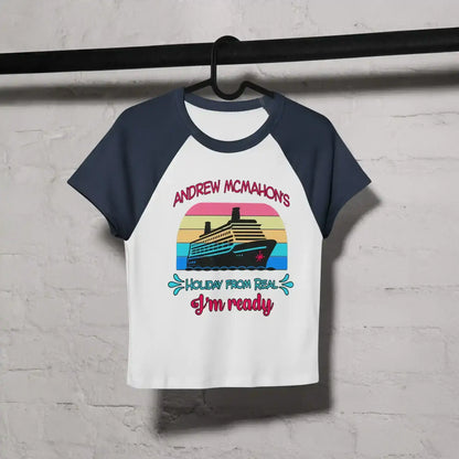 Women's white and navy raglan baby tee with cruise ship graphic and fun text, hanging on hanger