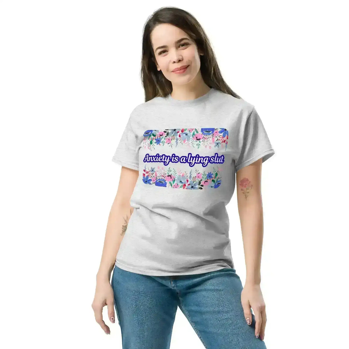 Woman wearing light gray graphic tee with floral design and dark humor quote from Cady Creations