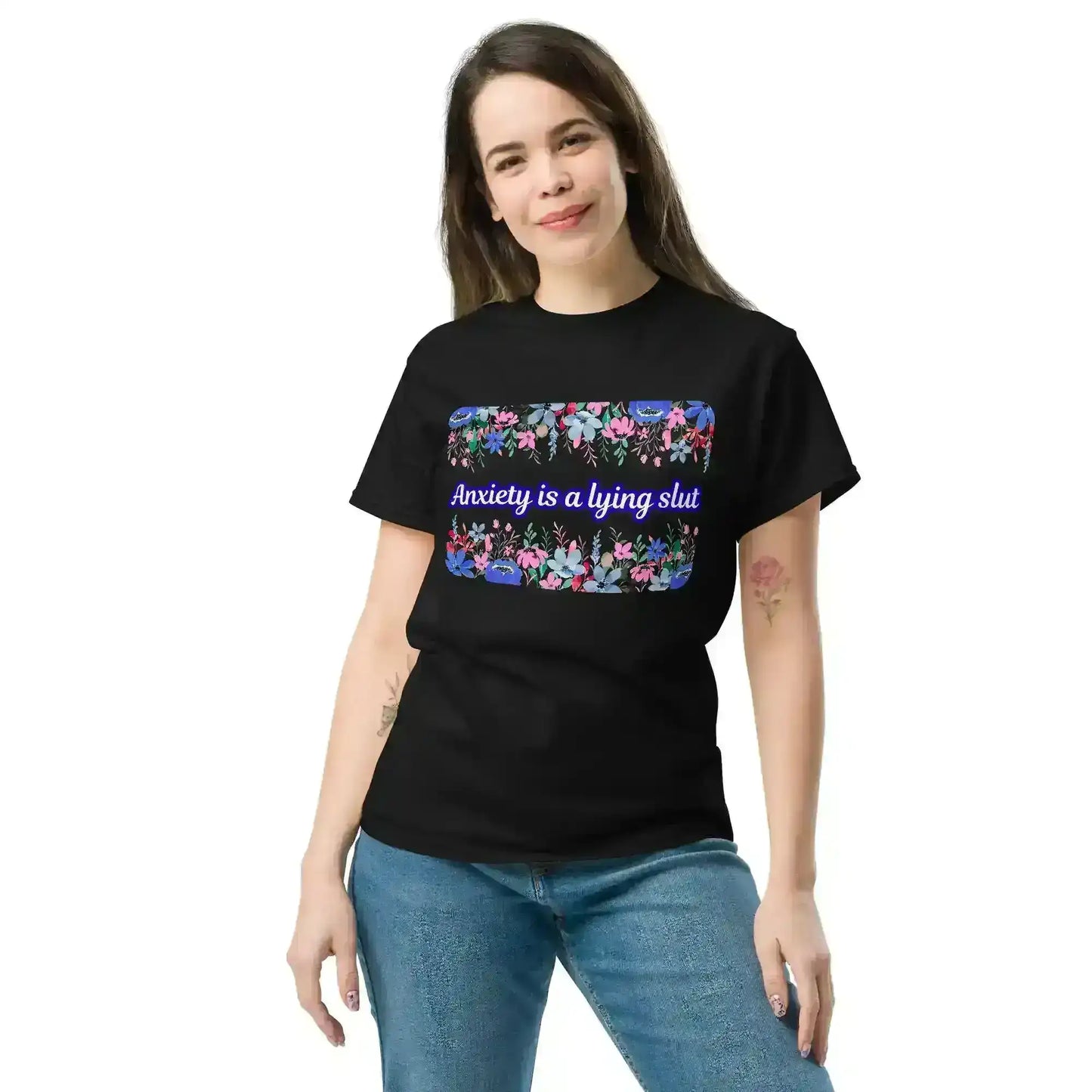 Woman wearing black unisex graphic tee with floral pattern and bold mental health slogan