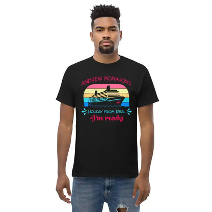 Man wears black graphic tee with cruise ship, colorful sunset, and 'Holiday from Real I'm ready' text.