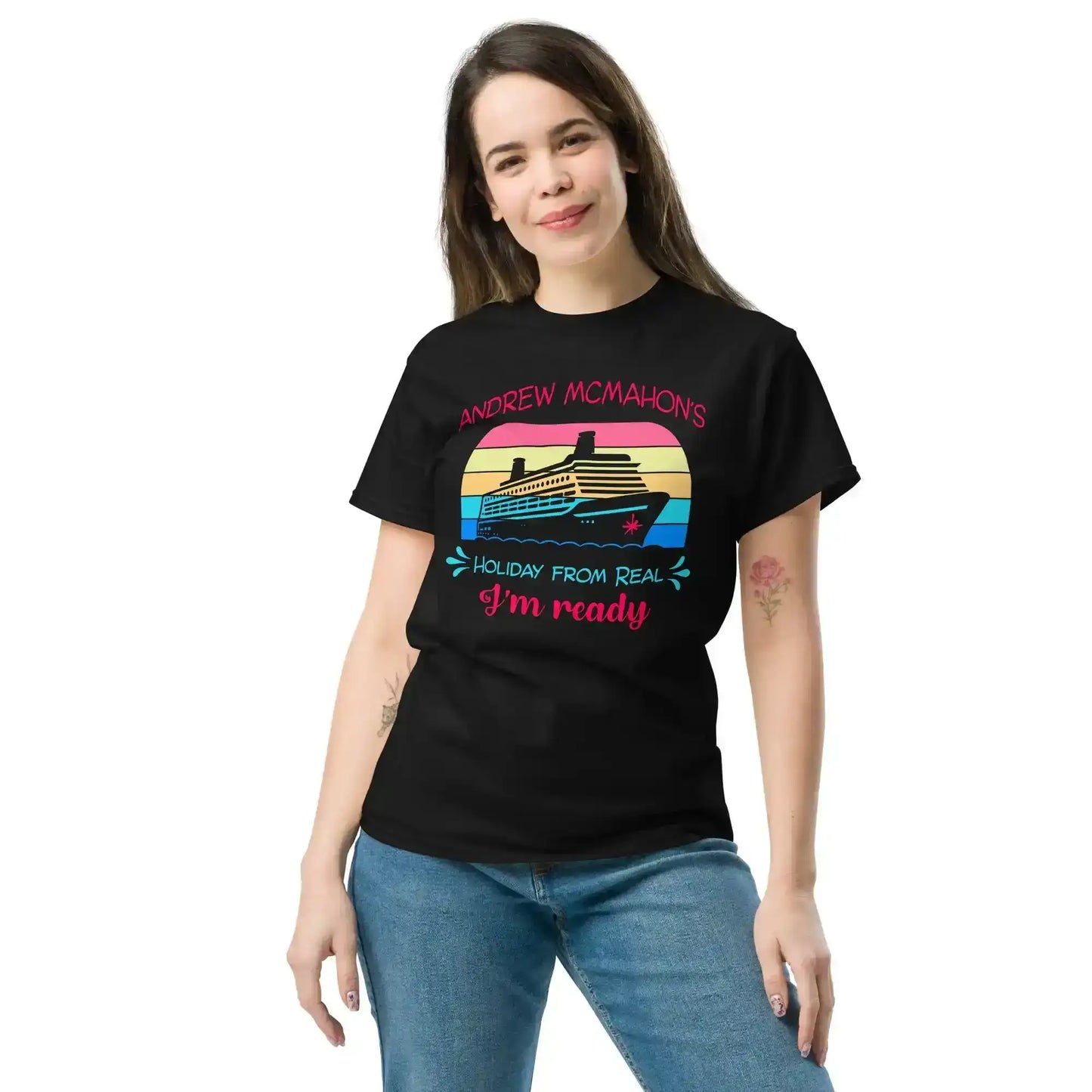 Woman wearing black graphic tee with cruise ship and colorful 'Holiday From Real' design by Cady Creations