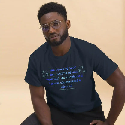 Man wearing navy unisex graphic tee with motivational text, Cady Creations apparel