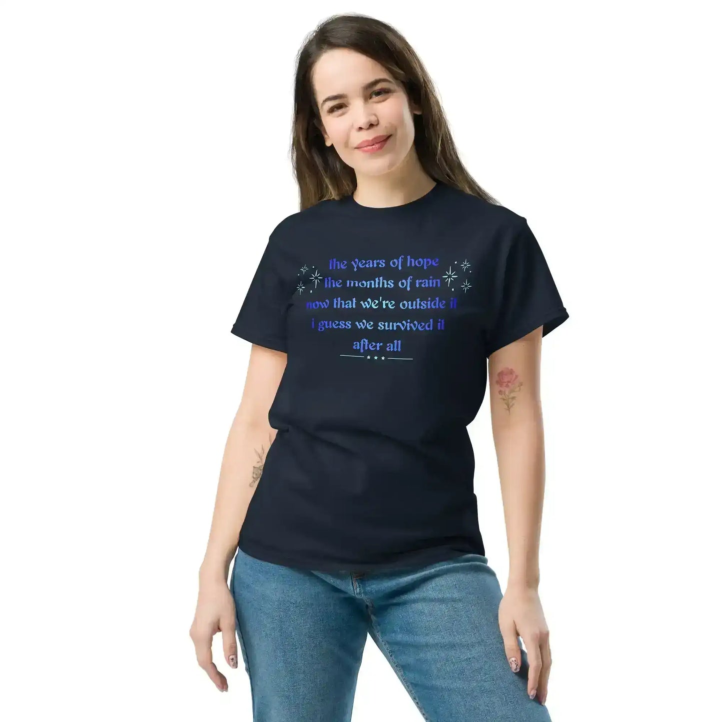 Woman wearing Cady Creations navy graphic tee with blue inspirational text and casual jeans