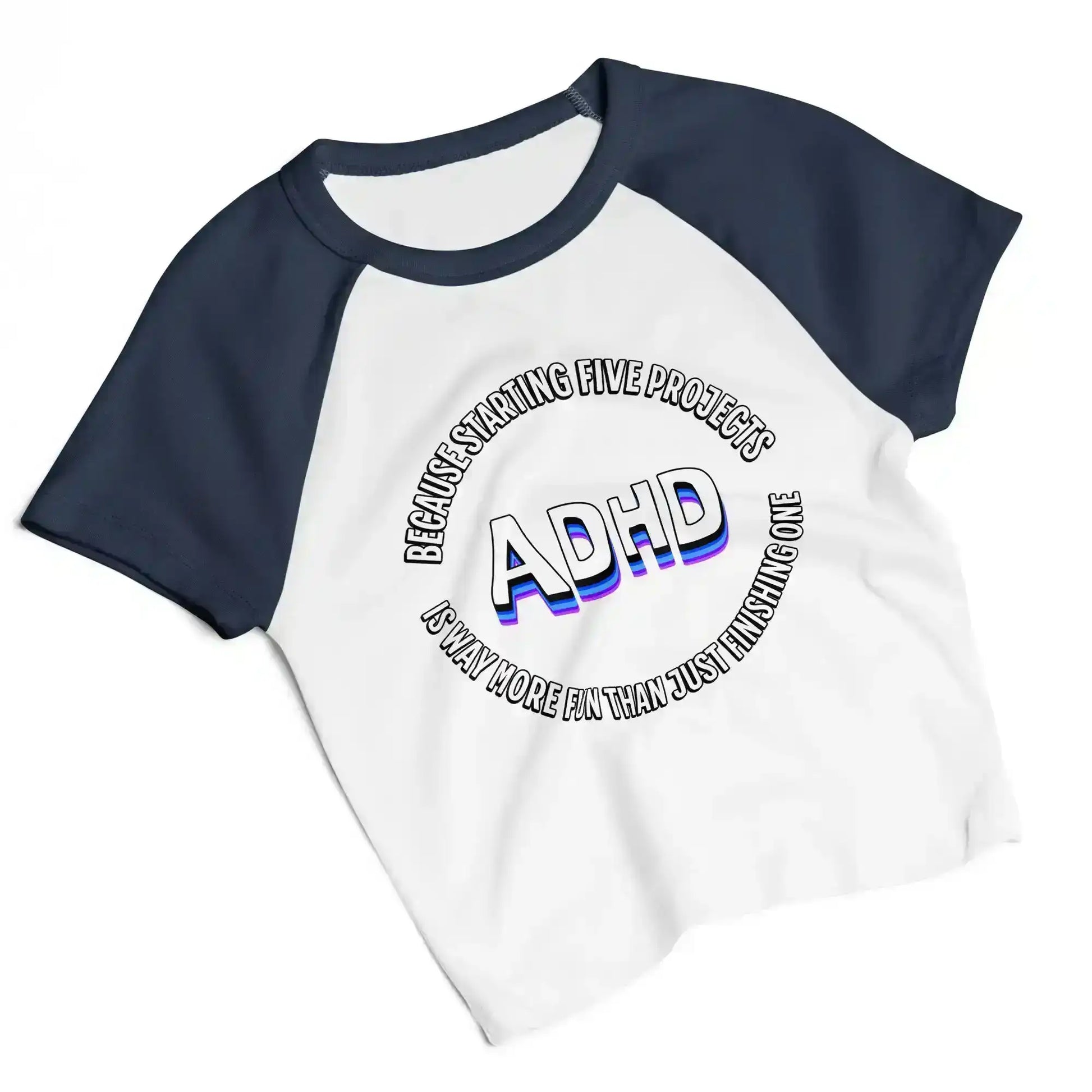 Women's white and navy raglan baby tee with 'ADHD' graphic text from Cady Creations.